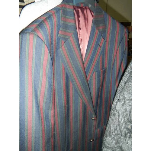 814 - 2 rails of vintage and other clothing including jackets, coats, football shirts etc.,