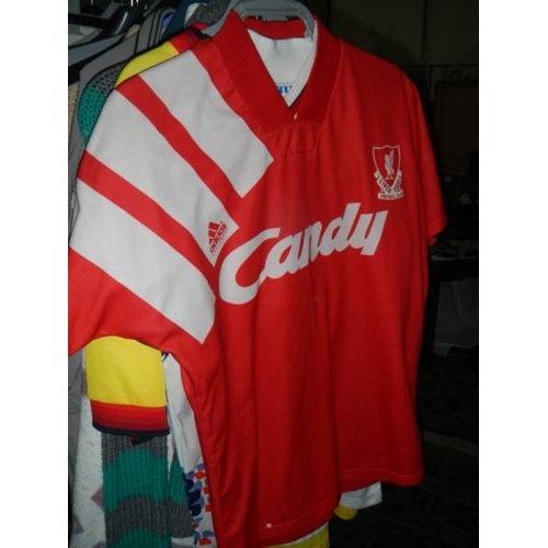 814 - 2 rails of vintage and other clothing including jackets, coats, football shirts etc.,