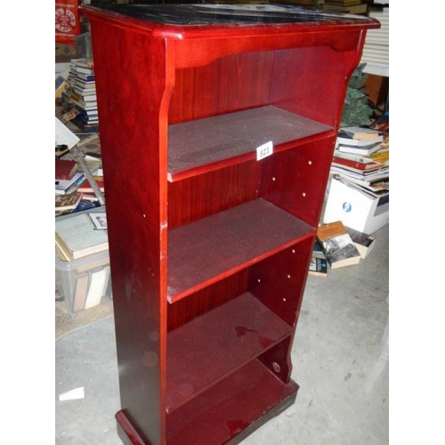 823 - A slim mahogany bookcase.