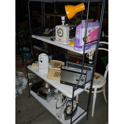 826 - A mixed lot of electric items including can opener, irons, radio, mixer etc.,