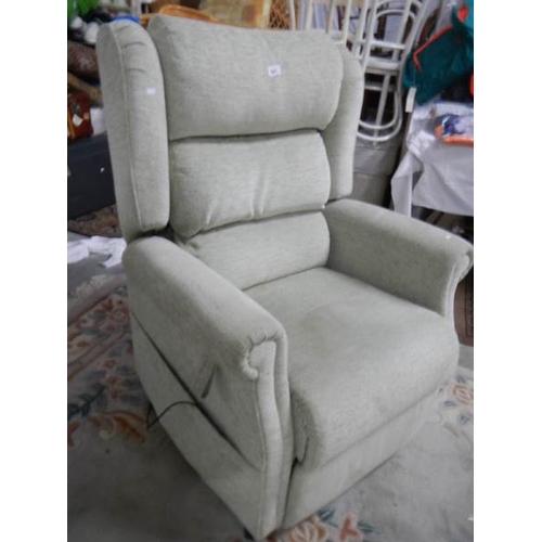 841 - An electric reclining arm chair in good condition.