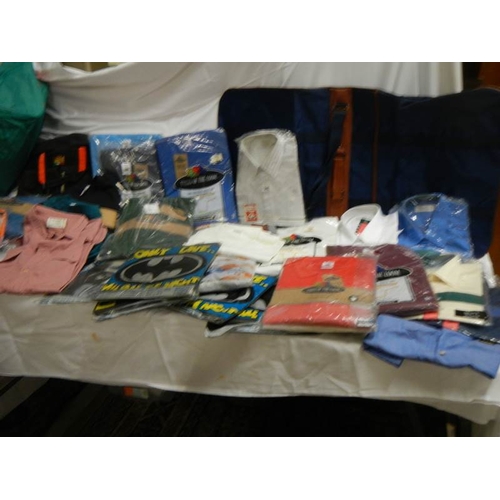 845 - A large quantity of shirts, Tee shirts, sweat shirts etc.,