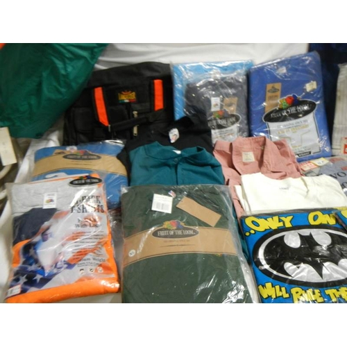 845 - A large quantity of shirts, Tee shirts, sweat shirts etc.,