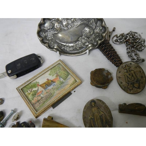 551 - An old tin and contents including bank notes, art nouveau pin tray etc.,