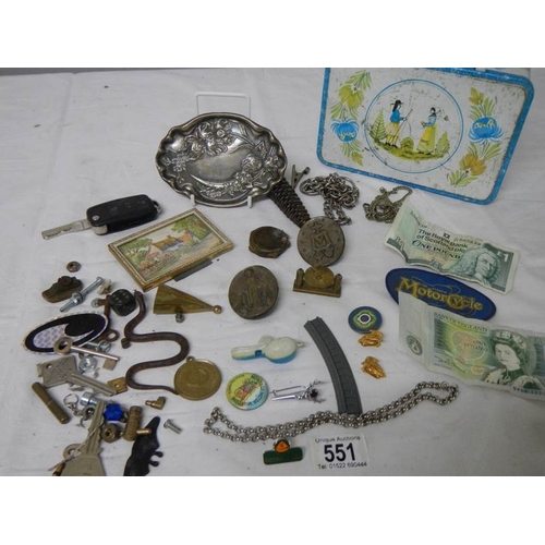 551 - An old tin and contents including bank notes, art nouveau pin tray etc.,