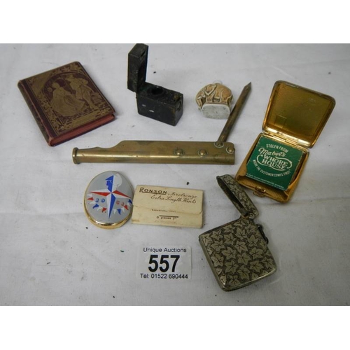 557 - A mixed lot including silver plate vesta case, match holder, elephant scent bottle etc.,