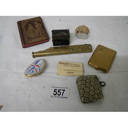 557 - A mixed lot including silver plate vesta case, match holder, elephant scent bottle etc.,