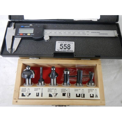 558 - An electronic digital calliper and a set of 6 new router bits.