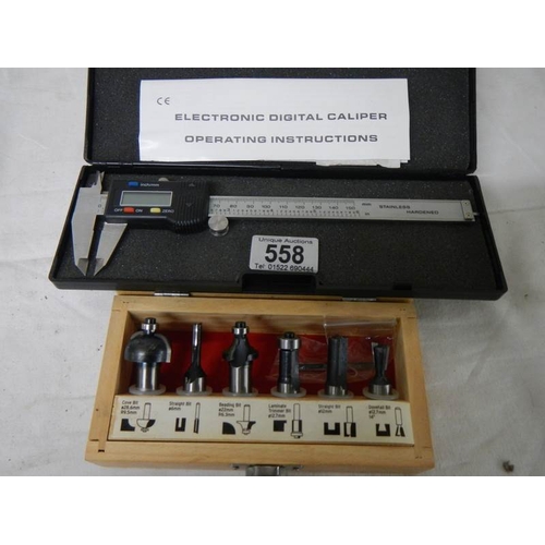 558 - An electronic digital calliper and a set of 6 new router bits.