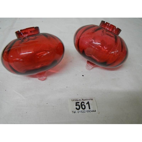 561 - 2 cranberry glass peg oil lamp fonts in good condition.