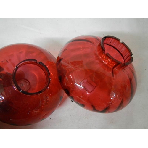 561 - 2 cranberry glass peg oil lamp fonts in good condition.