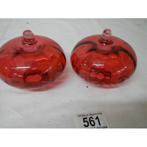 561 - 2 cranberry glass peg oil lamp fonts in good condition.