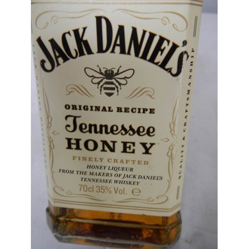 563 - A bottle of Jack Daniels Tennessee Honey Whiskey.