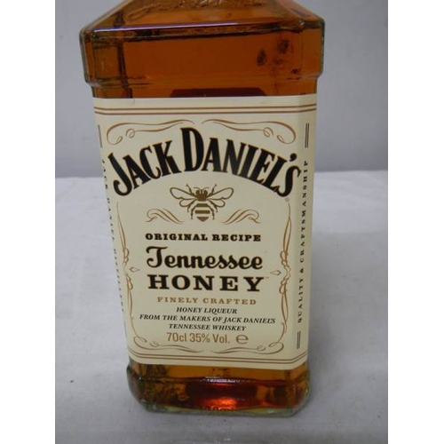 564 - A bottle of Jack Daniels Tennessee Honey Whiskey.