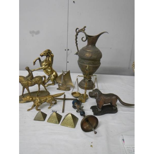 569 - A mixed lot of brassware including dog nut cracker, rearing horse, dog, balance scales etc.,