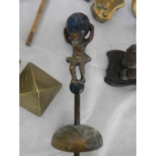 569 - A mixed lot of brassware including dog nut cracker, rearing horse, dog, balance scales etc.,