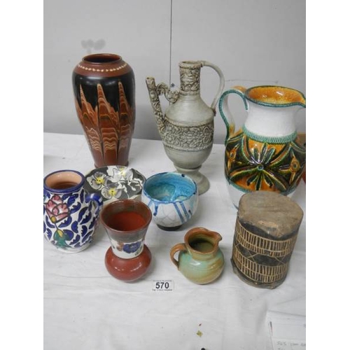 570 - A good mixed lot of studio pottery including Italian jug, early drum etc.,