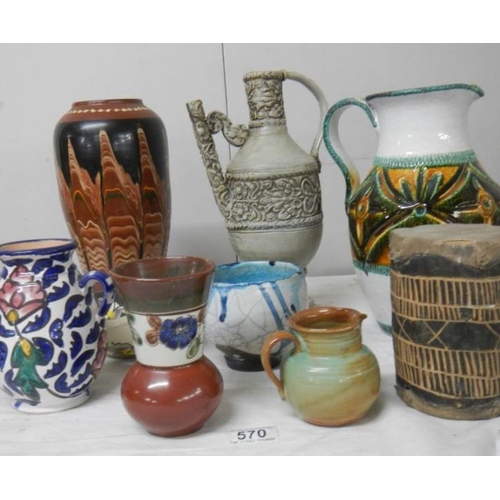 570 - A good mixed lot of studio pottery including Italian jug, early drum etc.,