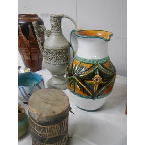 570 - A good mixed lot of studio pottery including Italian jug, early drum etc.,