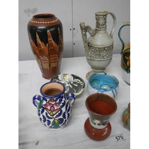 570 - A good mixed lot of studio pottery including Italian jug, early drum etc.,