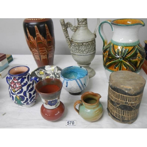 570 - A good mixed lot of studio pottery including Italian jug, early drum etc.,