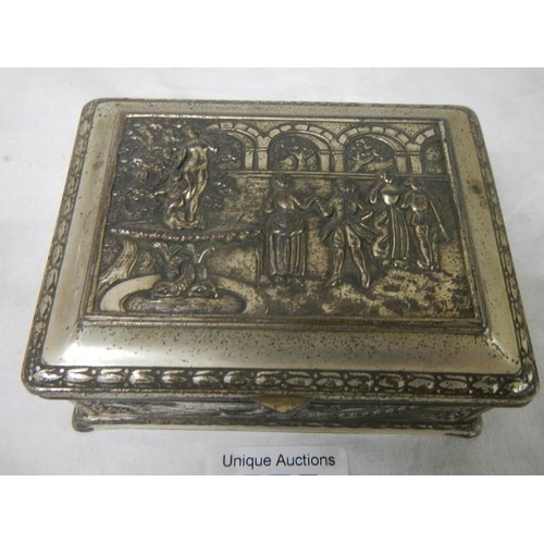 575 - An embossed silver plated box decorated with Elizabethan dancers in a court yard, plate worn.  11 x ... 