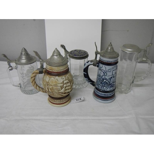 578 - Three glass beer steins and 2 Avon pottery beer steins.