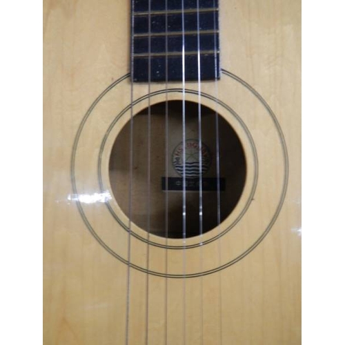 579 - A six string acoustic guitar.