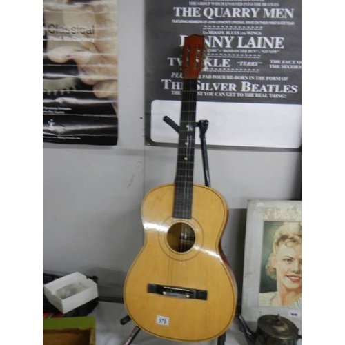 579 - A six string acoustic guitar.