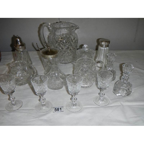 581 - A good lot of but glass including candlesticks, sugar sifters, jam pots, jugs etc., (14 items).