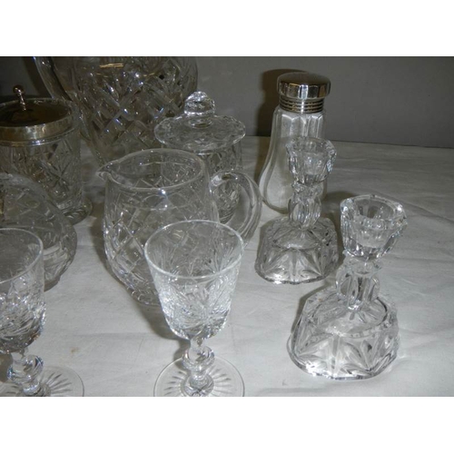 581 - A good lot of but glass including candlesticks, sugar sifters, jam pots, jugs etc., (14 items).