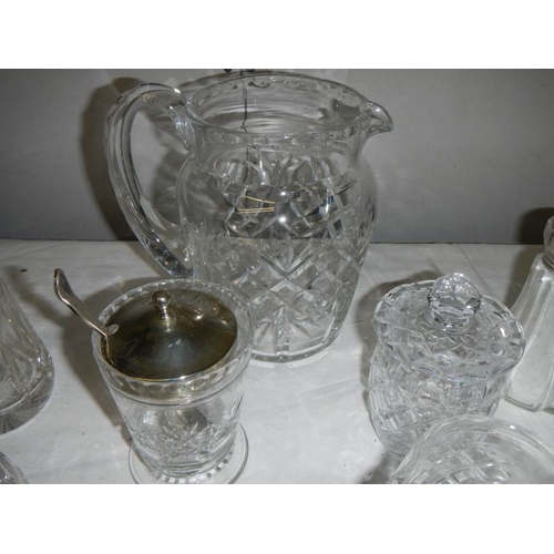 581 - A good lot of but glass including candlesticks, sugar sifters, jam pots, jugs etc., (14 items).