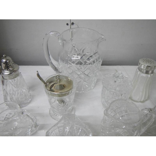 581 - A good lot of but glass including candlesticks, sugar sifters, jam pots, jugs etc., (14 items).