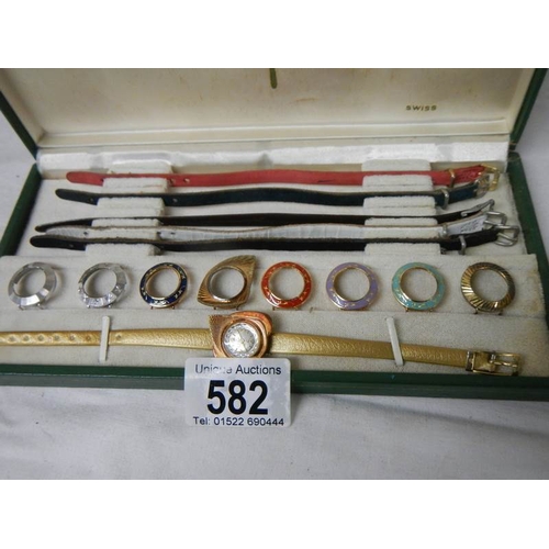 582 - A boxed vintage Titoni Coloursdope 9 ladies wrist watch with 9 interchangable head covers (missing 3... 