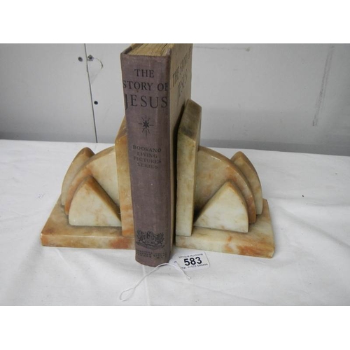 583 - A pair of marble book ends in good condition,.