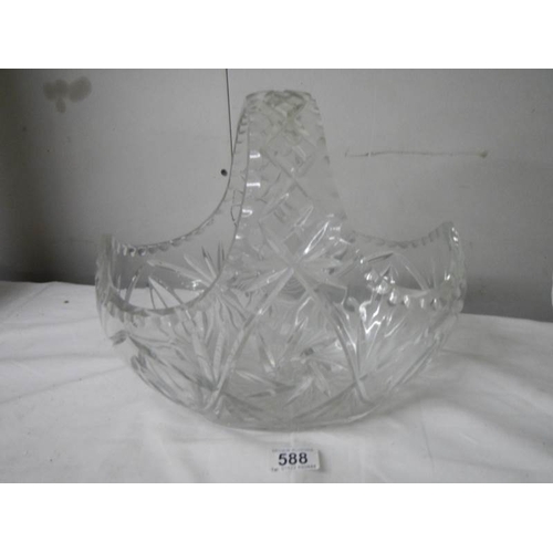 588 - A large cut glass basket, 30cm wide x 27cm tall.