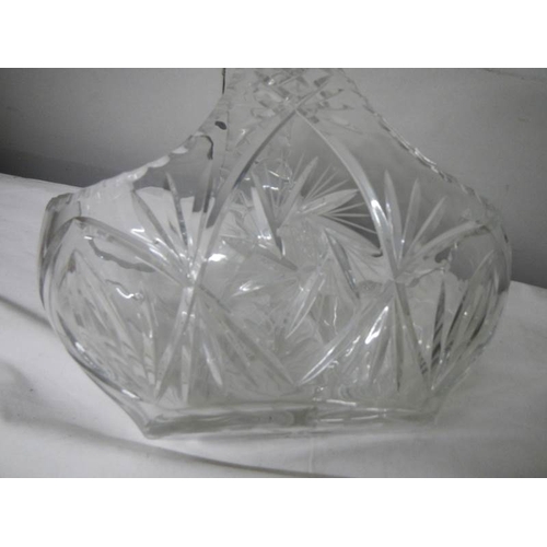 588 - A large cut glass basket, 30cm wide x 27cm tall.