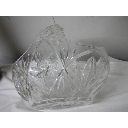 588 - A large cut glass basket, 30cm wide x 27cm tall.