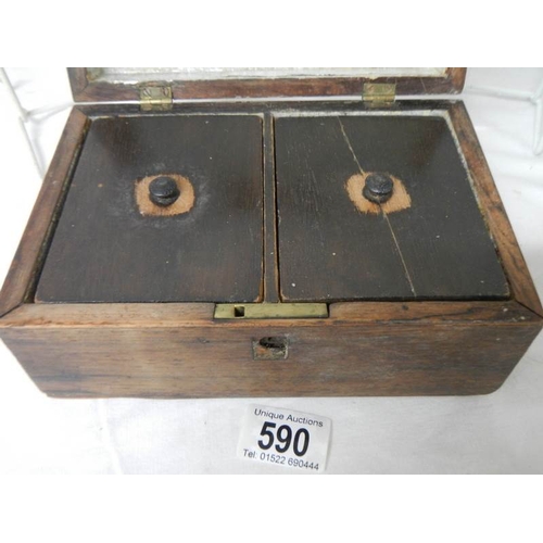 590 - A rosewood tea caddy (crack to one lid).