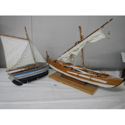 591 - 2 good model sailing boats, small 33 cm long, large 62 cm long.