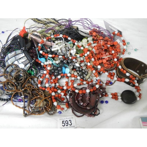 593 - A mixed lot of unsorted costume jewellery.