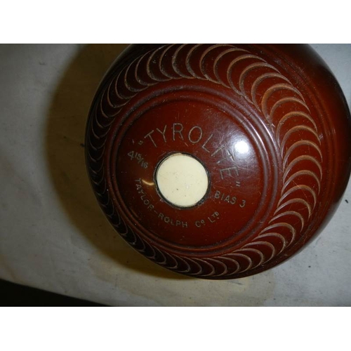 600 - A cased pair of vintage lawn bowls.