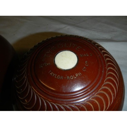 600 - A cased pair of vintage lawn bowls.