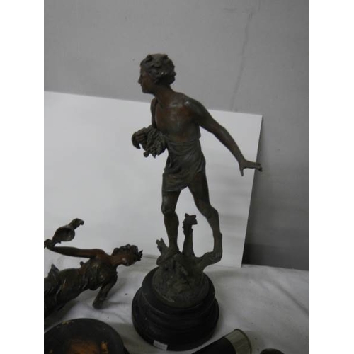 601 - A mixed lot of brass and spelter items and old torches (one figure a/f).