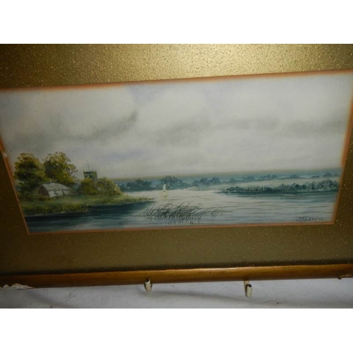 606 - A pair of framed and glazed rural scene watercolours signed  S Russell.