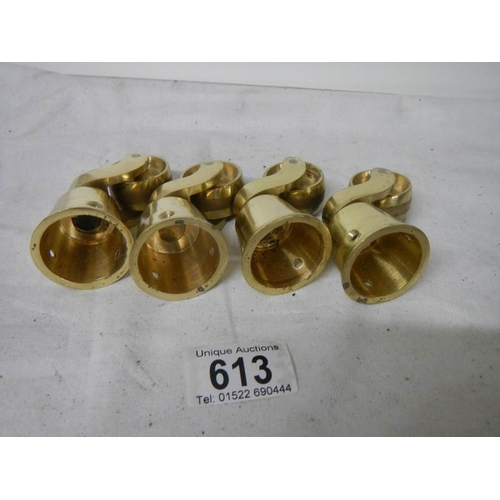 613 - A set of 4 new brass table casters, internal diameter of cup 3.5 cm.