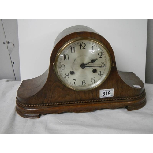 619 - A mahogany mantel clock in working order.