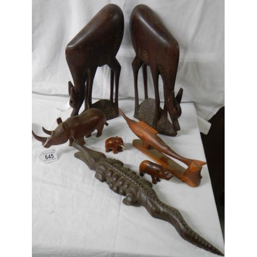 645 - A mixed lot of wooden items including 45 cm long crocodile and 36 cm tall antelope.