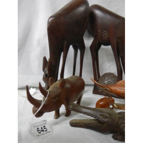 645 - A mixed lot of wooden items including 45 cm long crocodile and 36 cm tall antelope.