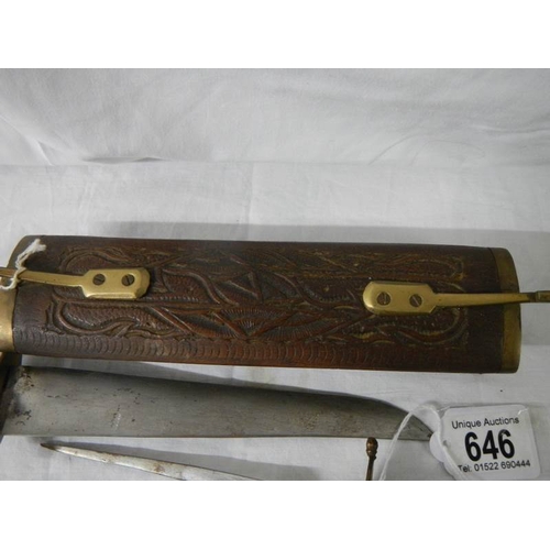 646 - An unusual carving set in a carved wood case and a bottle opener.